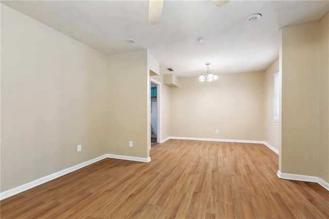 5927 Brighton Pl, New Orleans, LA 70131 - unfurnished room featuring a chandelier, light wood finished floors, and baseboards