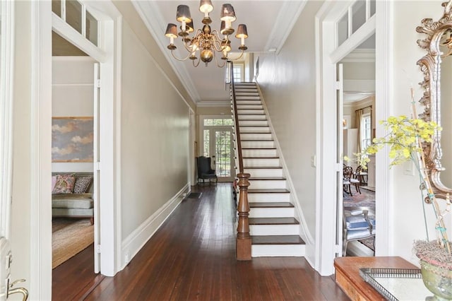 919 Robert St, New Orleans, LA 70115 - foyer with ornamental molding, stairs, dark wood-style flooring, a chandelier, and baseboards
