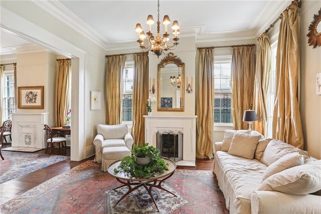 919 Robert St, New Orleans, LA 70115 - living area with a fireplace, a chandelier, hardwood / wood-style flooring, and crown molding
