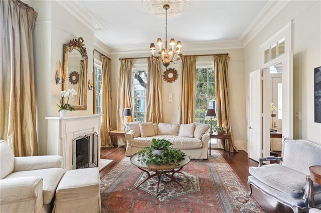 919 Robert St, New Orleans, LA 70115 - living area featuring a chandelier, dark wood-style flooring, ornamental molding, a fireplace with flush hearth, and baseboards