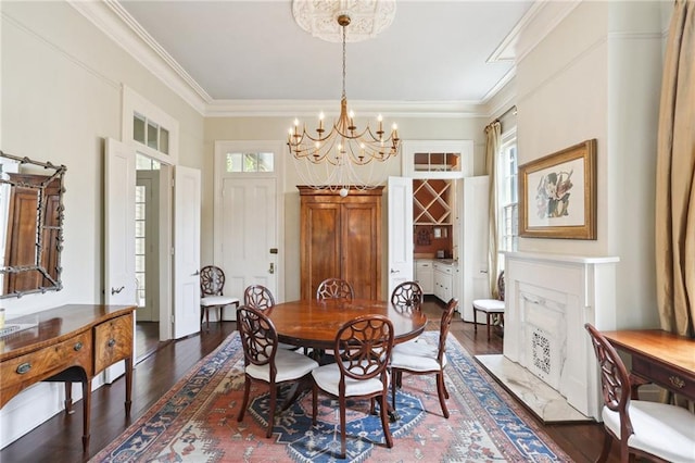 919 Robert St, New Orleans, LA 70115 - dining room with a chandelier, dark wood-style flooring, and ornamental molding