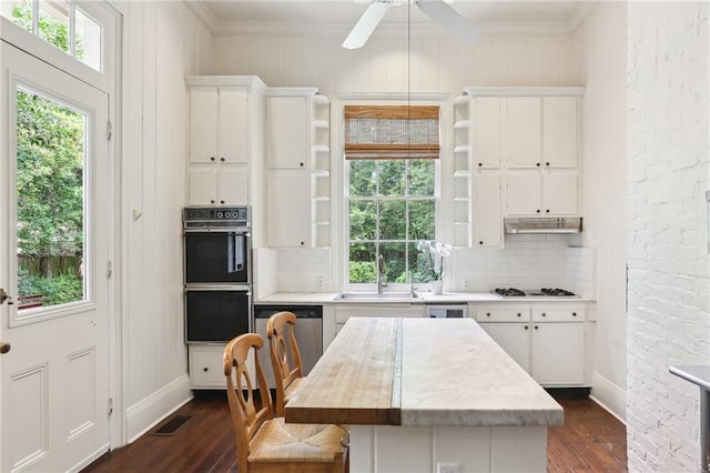 919 Robert St, New Orleans, LA 70115 - kitchen featuring open shelves, a sink, light countertops, dark wood-type flooring, and ornamental molding