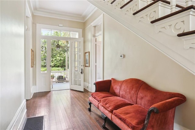 919 Robert St, New Orleans, LA 70115 - foyer featuring crown molding, hardwood / wood-style flooring, and baseboards