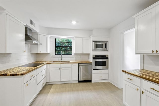 48 Bleu Lake Dr, Covington, LA 70435 - kitchen featuring stainless steel appliances, wooden counters, and a sink
