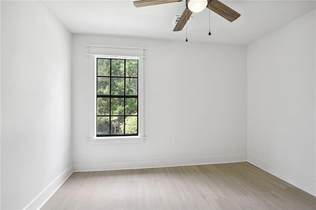 48 Bleu Lake Dr, Covington, LA 70435 - empty room featuring wood finished floors, a ceiling fan, and baseboards