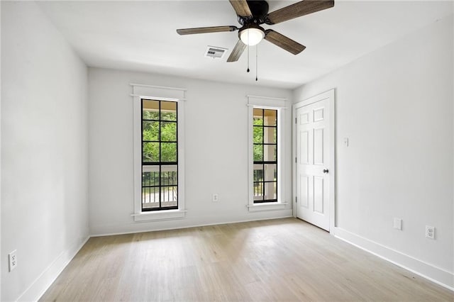 48 Bleu Lake Dr, Covington, LA 70435 - unfurnished room with wood finished floors, baseboards, and a ceiling fan