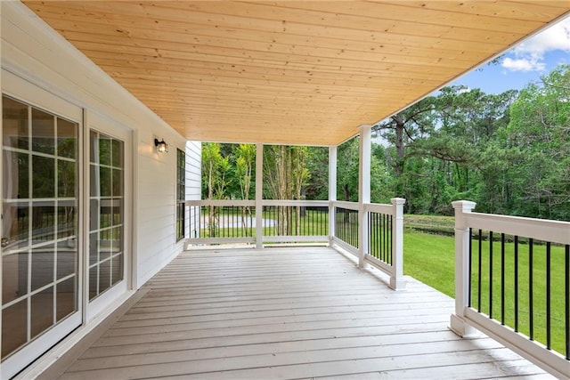 48 Bleu Lake Dr, Covington, LA 70435 - wooden deck featuring a yard and view of scattered trees
