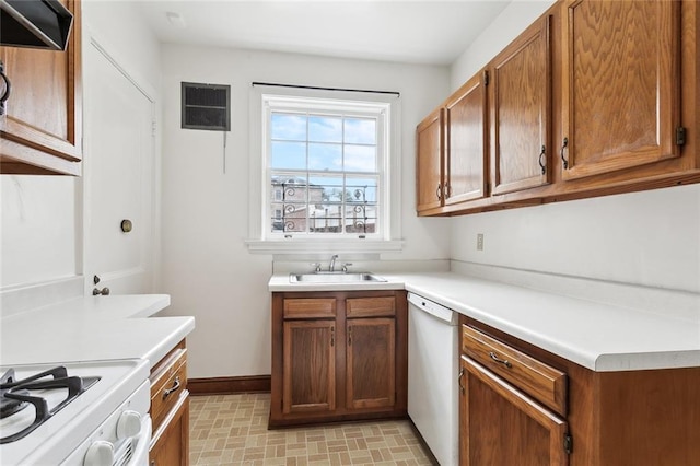 5402 St Charles Ave, New Orleans, LA 70115 - kitchen with white appliances, a sink, brown cabinets, and light countertops