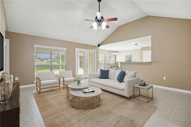 709 Bridle Ct, Covington, LA 70435 - living room featuring light tile patterned floors, lofted ceiling, a ceiling fan, baseboards, and a chandelier
