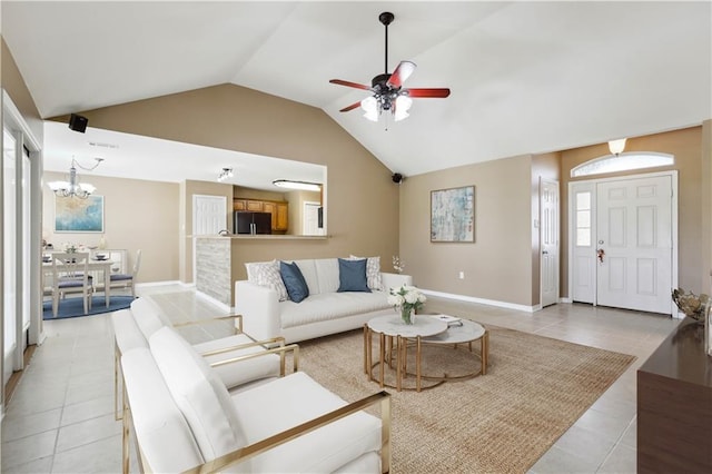 709 Bridle Ct, Covington, LA 70435 - living area featuring light tile patterned floors, lofted ceiling, a ceiling fan, a chandelier, and baseboards