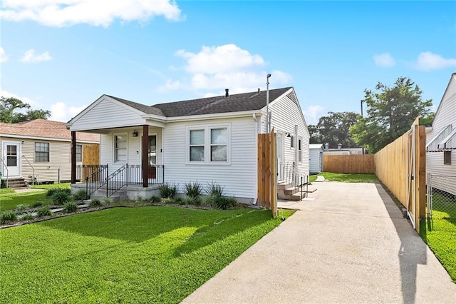 313 Harang Ave, Metairie, LA 70001 - bungalow with driveway, entry steps, and a shingled roof