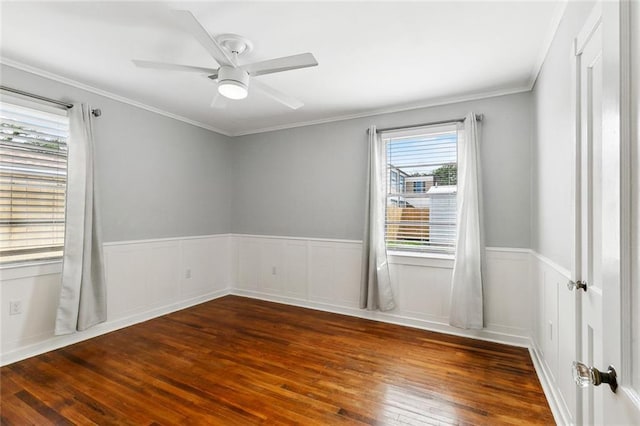 313 Harang Ave, Metairie, LA 70001 - unfurnished room with hardwood / wood-style floors, plenty of natural light, wainscoting, a ceiling fan, and crown molding