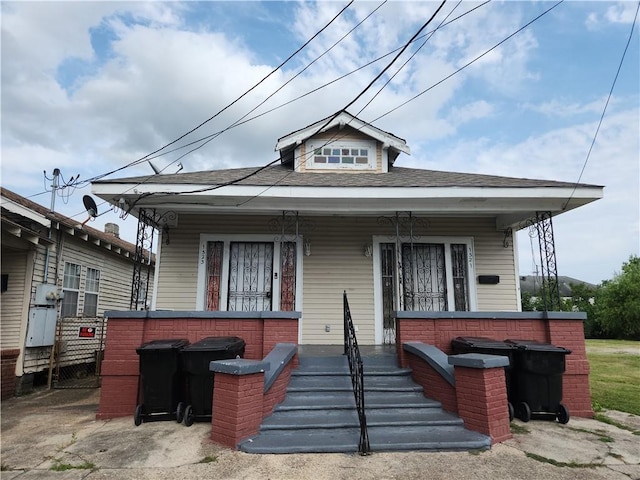 1523 Alvar St, New Orleans, LA 70117 - view of front facade featuring a porch and roof with shingles