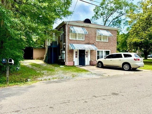 1742 4th St, Slidell, LA 70458 - view of front of home featuring brick siding and driveway