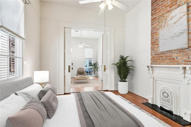 3119 Dauphine St, New Orleans, LA 70117 - bedroom with wood finished floors and a ceiling fan