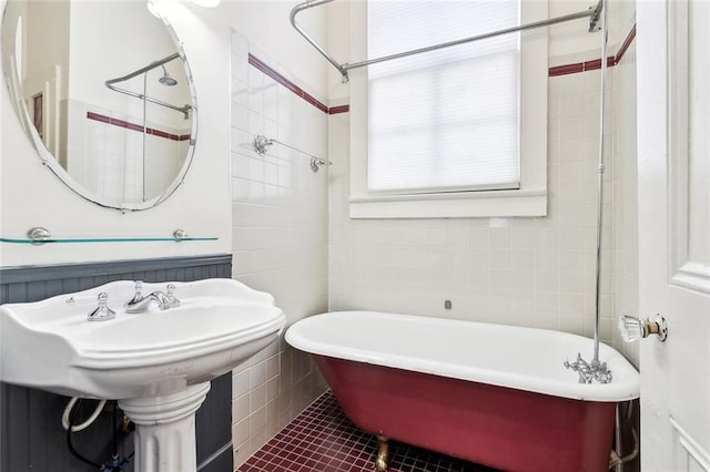 3119 Dauphine St, New Orleans, LA 70117 - full bathroom featuring a soaking tub, tile walls, and tile patterned floors