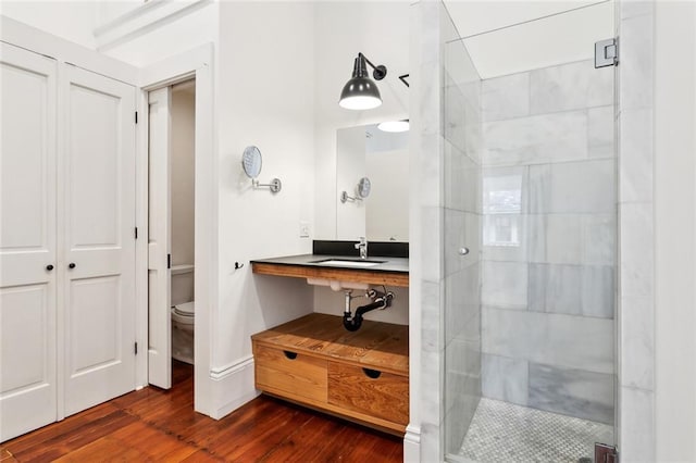 3119 Dauphine St, New Orleans, LA 70117 - full bath featuring a stall shower and wood finished floors