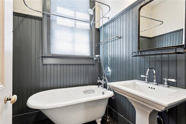 3119 Dauphine St, New Orleans, LA 70117 - bathroom featuring a freestanding tub and healthy amount of natural light