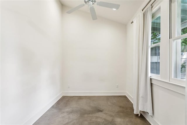 3119 Dauphine St, New Orleans, LA 70117 - unfurnished room featuring dark carpet, vaulted ceiling, and a ceiling fan
