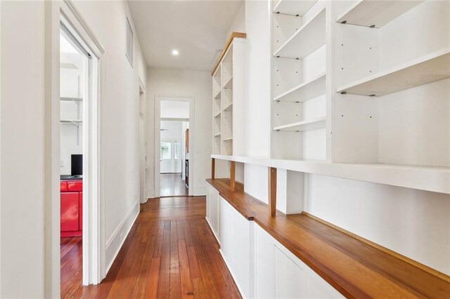 3119 Dauphine St, New Orleans, LA 70117 - corridor featuring dark wood-style flooring and recessed lighting
