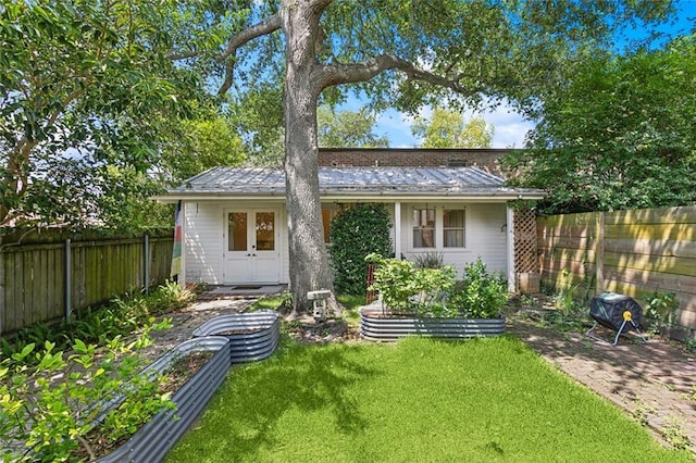 3119 Dauphine St, New Orleans, LA 70117 - view of outdoor structure with a vegetable garden and a fenced backyard