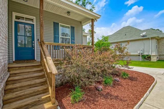 61113 Jade St, Lacombe, LA 70445 - view of exterior entry with a porch