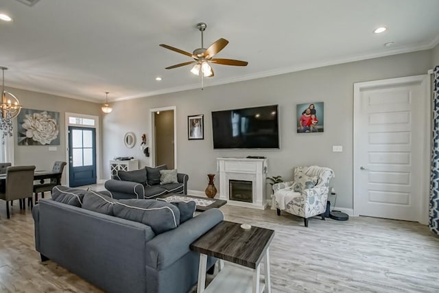 61113 Jade St, Lacombe, LA 70445 - living room featuring light wood-style flooring, ornamental molding, ceiling fan, baseboards, and recessed lighting