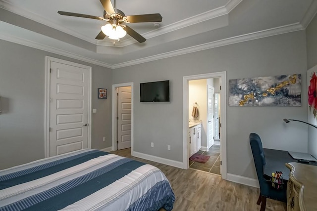 61113 Jade St, Lacombe, LA 70445 - bedroom with wood finished floors, a raised ceiling, ornamental molding, baseboards, and a ceiling fan