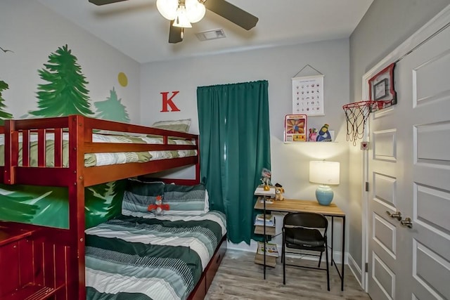 61113 Jade St, Lacombe, LA 70445 - bedroom with wood finished floors, a desk, a ceiling fan, and baseboards