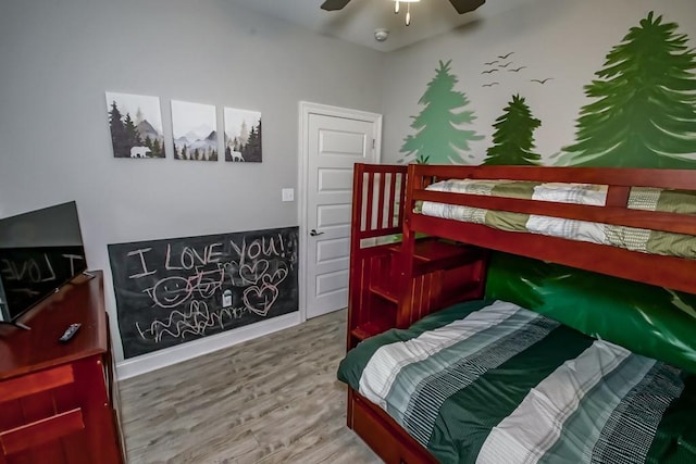 61113 Jade St, Lacombe, LA 70445 - bedroom with wood finished floors, a ceiling fan, and baseboards