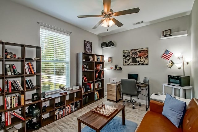 61113 Jade St, Lacombe, LA 70445 - office with a ceiling fan, wood finished floors, and plenty of natural light