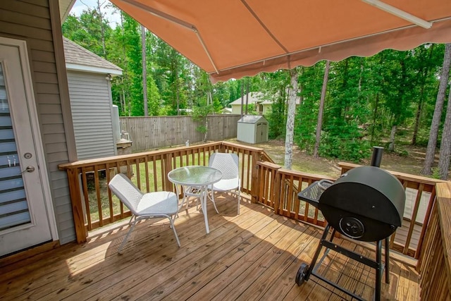 61113 Jade St, Lacombe, LA 70445 - wooden deck with outdoor dining area and view of scattered trees