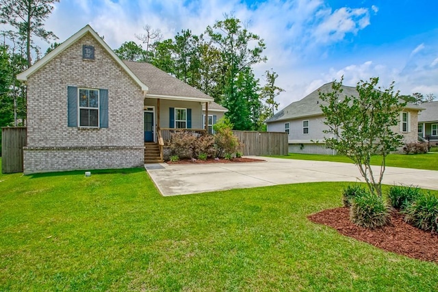 61113 Jade St, Lacombe, LA 70445 - view of front of home featuring brick siding and covered porch