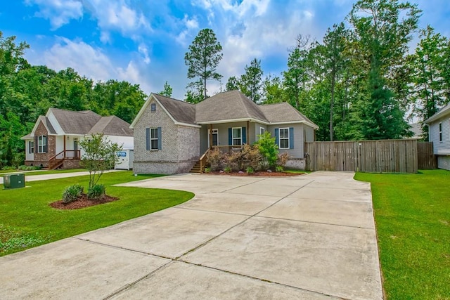 61113 Jade St, Lacombe, LA 70445 - view of front of house with brick siding, a gate, and driveway