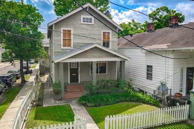 1039 Marengo St, New Orleans, LA 70115 - view of front of home with a porch and a fenced front yard