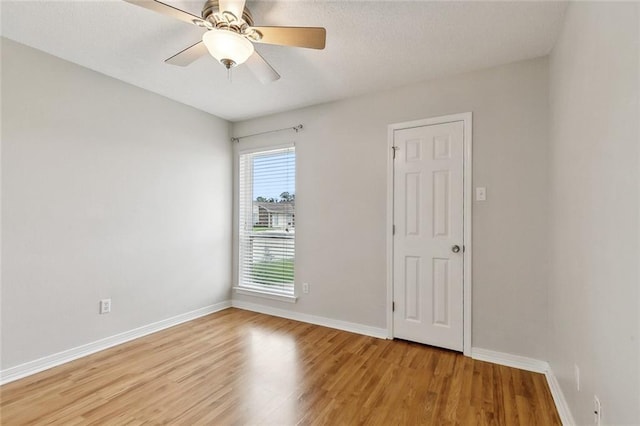 4740 Red Oak Dr, Marrero, LA 70072 - unfurnished room with light wood-style flooring, baseboards, and a ceiling fan