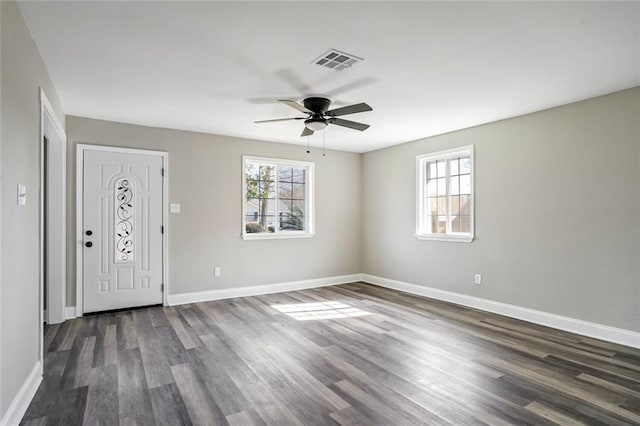 3417 W Louisiana State Dr, Kenner, LA 70065 - entryway featuring plenty of natural light, dark wood-type flooring, ceiling fan, and baseboards