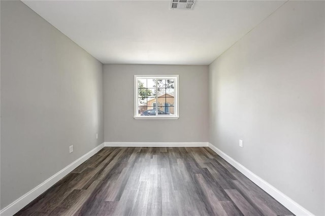 3417 W Louisiana State Dr, Kenner, LA 70065 - empty room with dark wood-style flooring and baseboards