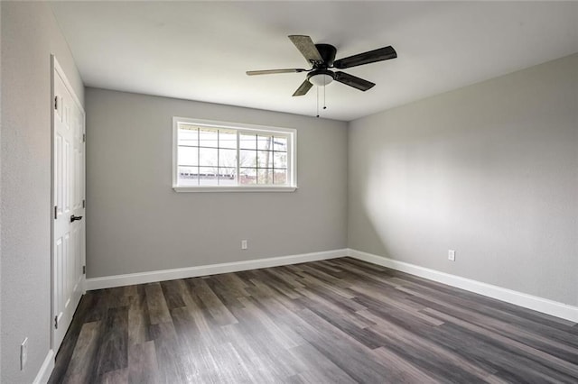 3417 W Louisiana State Dr, Kenner, LA 70065 - spare room with dark wood finished floors, ceiling fan, and baseboards