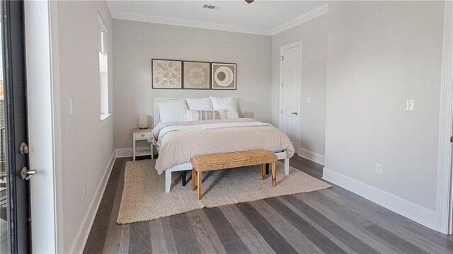 811 Rosa Ave, Metairie, LA 70005 - bedroom featuring crown molding, dark wood finished floors, and baseboards