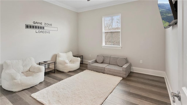 811 Rosa Ave, Metairie, LA 70005 - living room featuring ornamental molding, baseboards, and wood finished floors