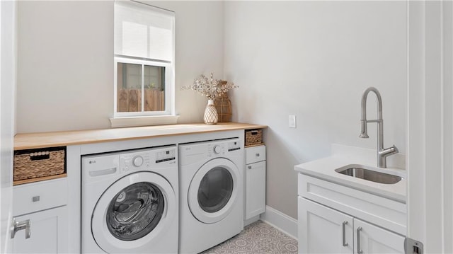 811 Rosa Ave, Metairie, LA 70005 - laundry room featuring washer and clothes dryer, cabinet space, and baseboards