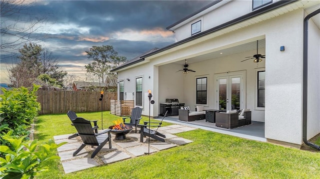 811 Rosa Ave, Metairie, LA 70005 - view of patio featuring ceiling fan, french doors, and an outdoor living space with a fire pit