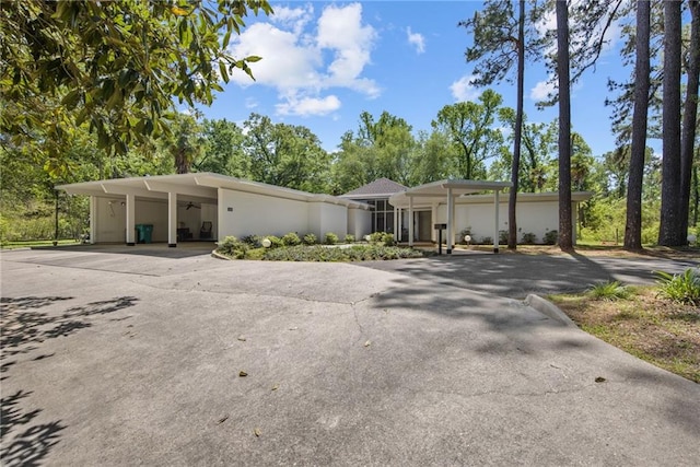 1450 Pine Tree Rd, Opelousas, LA 70570 - mid-century home featuring driveway, ceiling fan, and a carport