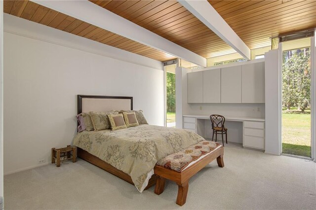 1450 Pine Tree Rd, Opelousas, LA 70570 - bedroom featuring light carpet, multiple windows, and wooden ceiling with exposed beams