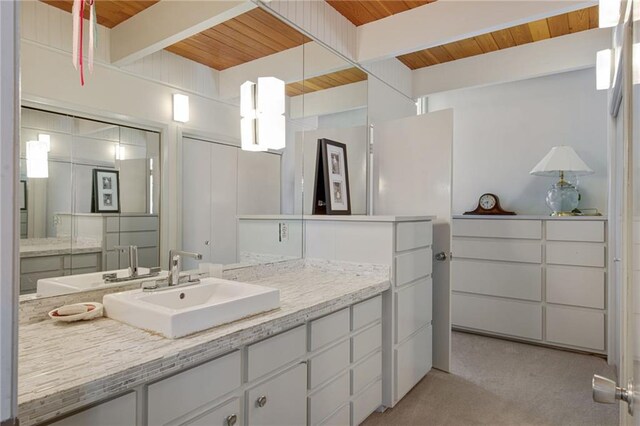 1450 Pine Tree Rd, Opelousas, LA 70570 - bathroom with wood ceiling with exposed beams and vanity