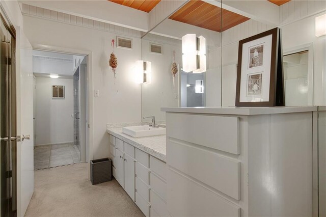 1450 Pine Tree Rd, Opelousas, LA 70570 - full bath with vanity and wooden ceiling with exposed beams