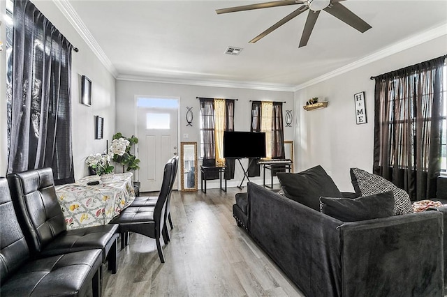 142325 Lamanche St, New Orleans, LA 70117 - living room with ceiling fan, light wood finished floors, and ornamental molding