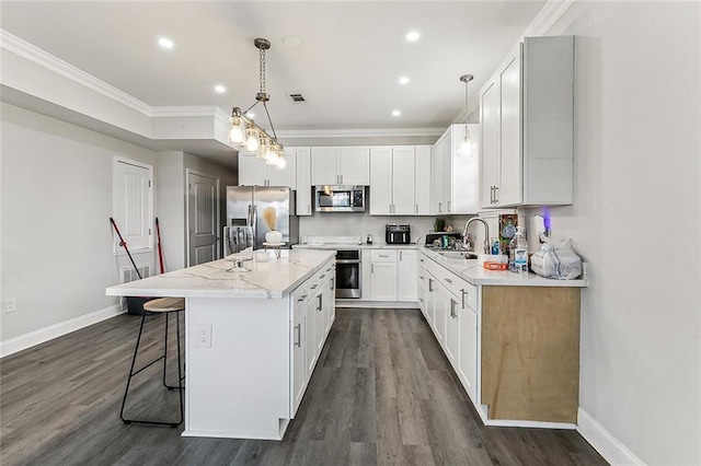 142325 Lamanche St, New Orleans, LA 70117 - kitchen with stainless steel appliances, a sink, a kitchen island, crown molding, and dark wood finished floors