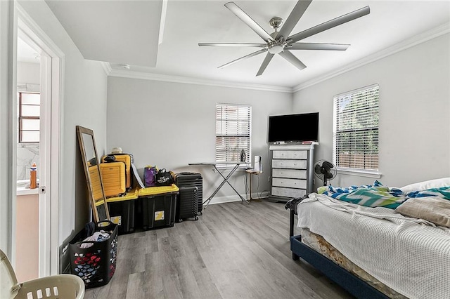 142325 Lamanche St, New Orleans, LA 70117 - bedroom featuring wood finished floors, ornamental molding, baseboards, and a ceiling fan